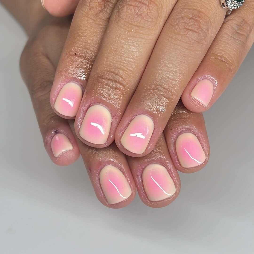 Short nails with glossy pink ombré for a clean, soft, and polished everyday look.