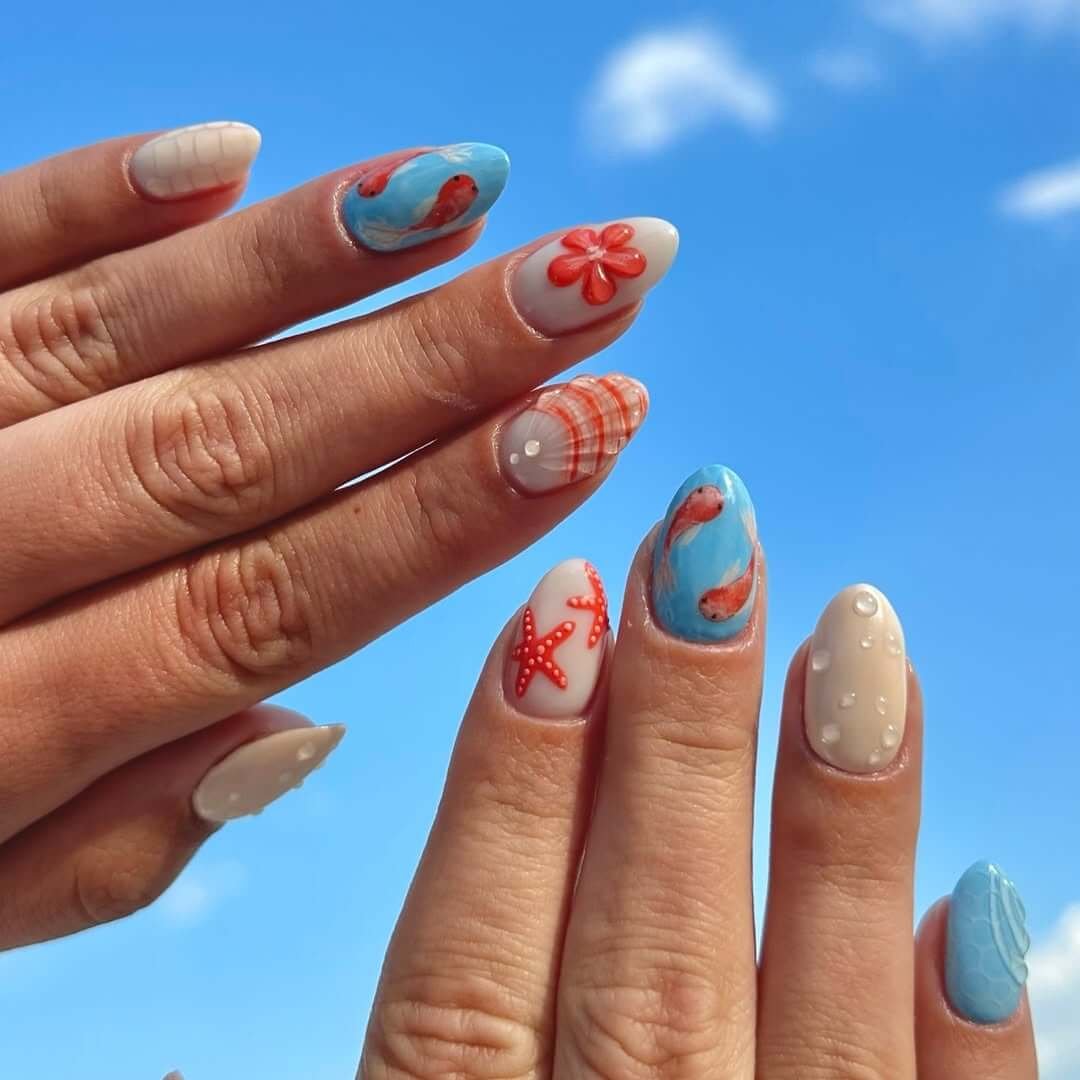 Almond short nails with koi fish, starfish, and coral prints for an ocean-inspired 3D beach design.